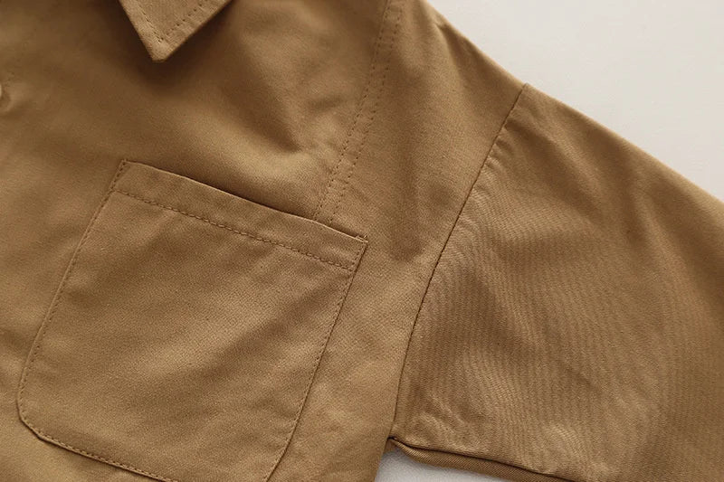 Close-up of boys casual fashion set long sleeve shirt and cargo pants in brown fabric showing pocket and sleeve details