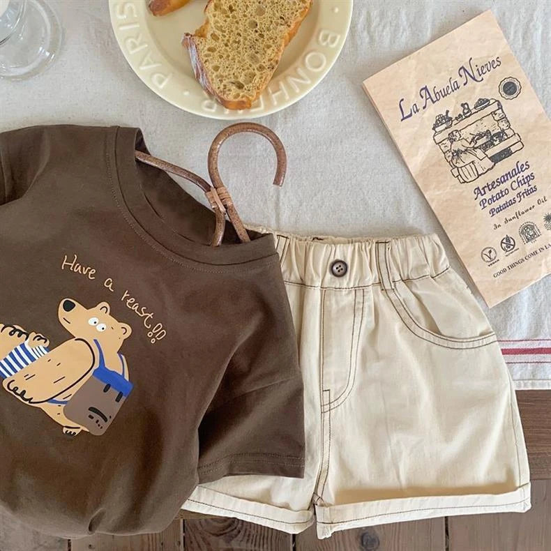 Boys Casual Loose O-Neck Short Sleeve T-Shirt with Printed Bear Summer Wear in brown displayed with beige shorts