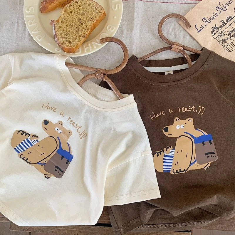 Boys Casual Loose O-Neck Short Sleeve T-Shirt with Printed Bear Summer Wear in white and brown colors displayed on wooden hangers