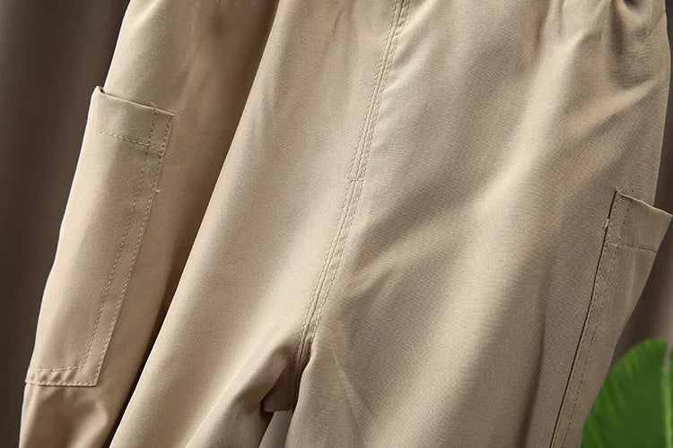 Close-up of beige pants pocket detail from Boys Korean Fashion Stripe Short Sleeve Top and Pants Summer Kids Outfit Set