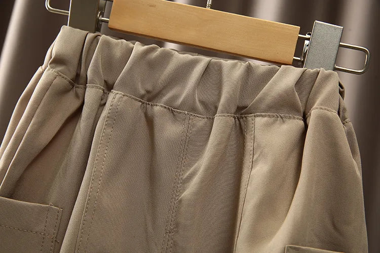 Close-up of elastic waistband and stitching details on boys Korean fashion stripe short sleeve top and pants summer kids outfit set