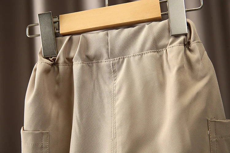 Close-up of beige pants from Boys Korean Fashion Stripe Short Sleeve Top and Pants Summer Kids Outfit Set by Yamza Tots' Closet