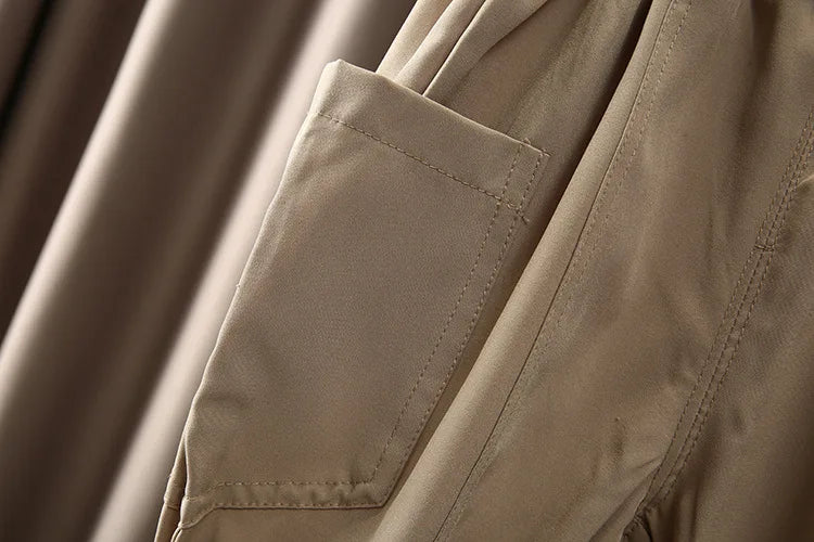 Close-up of beige pants pocket stitching from Boys Korean Fashion Stripe Short Sleeve Top and Pants Summer Kids Outfit Set