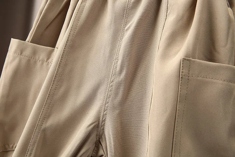 Close-up view of beige Boys Korean Fashion Stripe Short Sleeve Top and Pants Summer Kids Outfit Set with pockets
