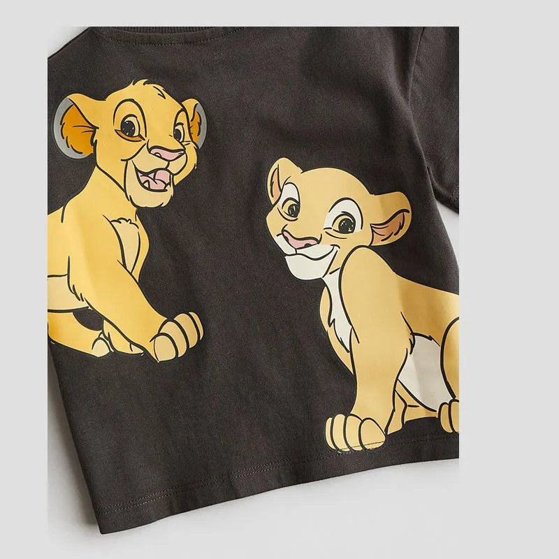 Boys Simba Print Short Sleeve T-Shirt and Shorts Tracksuit Summer Outfit with cartoon lion cub design on dark fabric