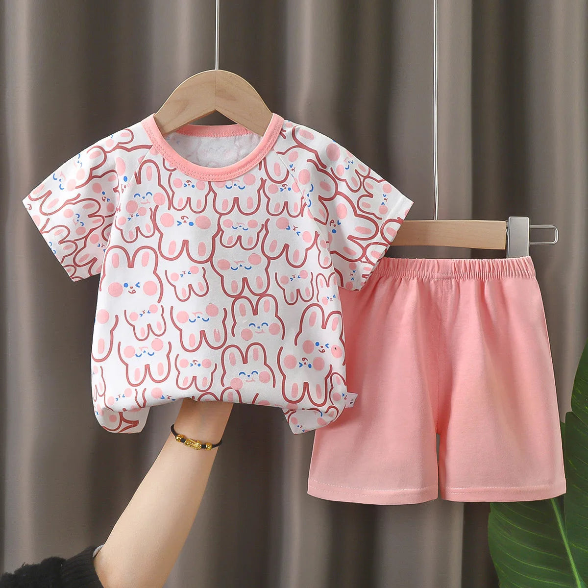Cartoon Kids Clothes 2 Piece Set Donald Duck T-shirt and Shorts Summer Outfit with pink bunny print and solid shorts