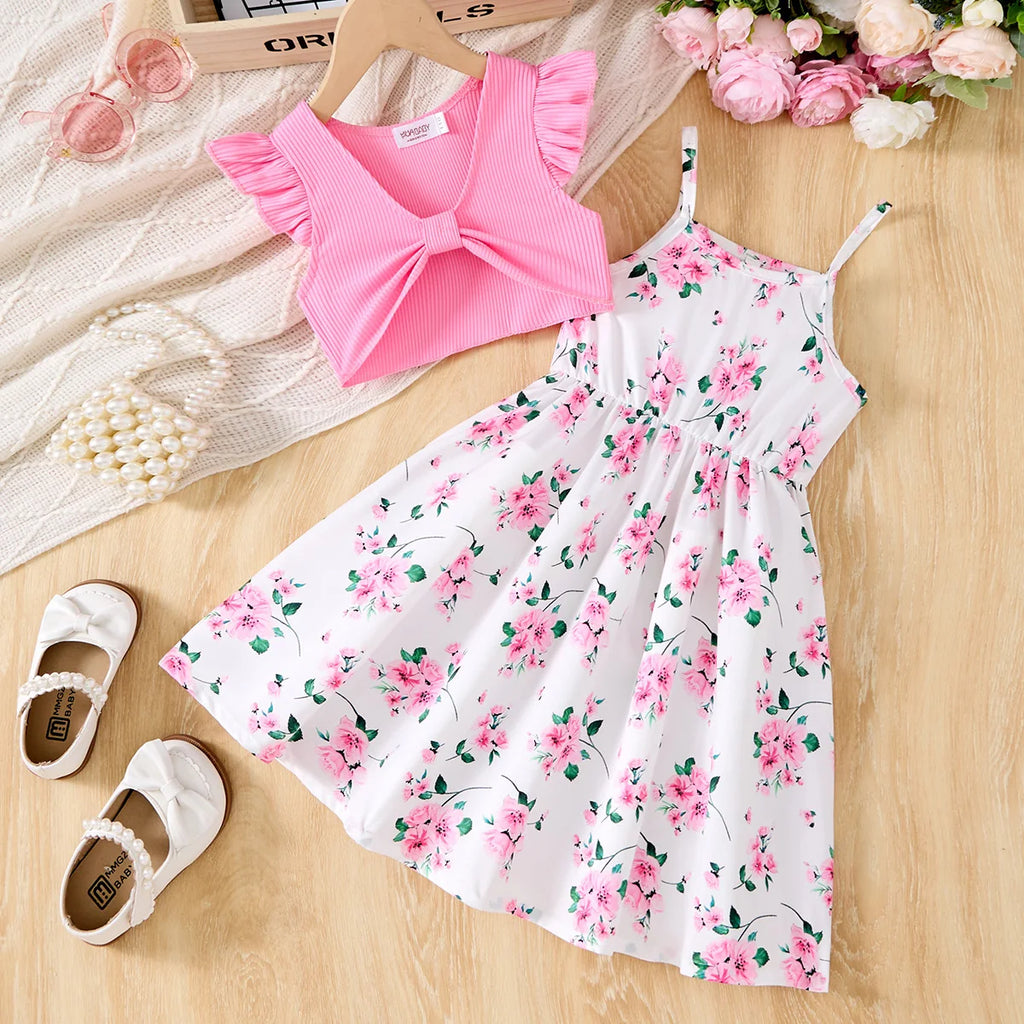 Children Casual Dress Girls Pink Knitted Top Floral Suspender Dress Summer Set laid out with white shoes and flowers