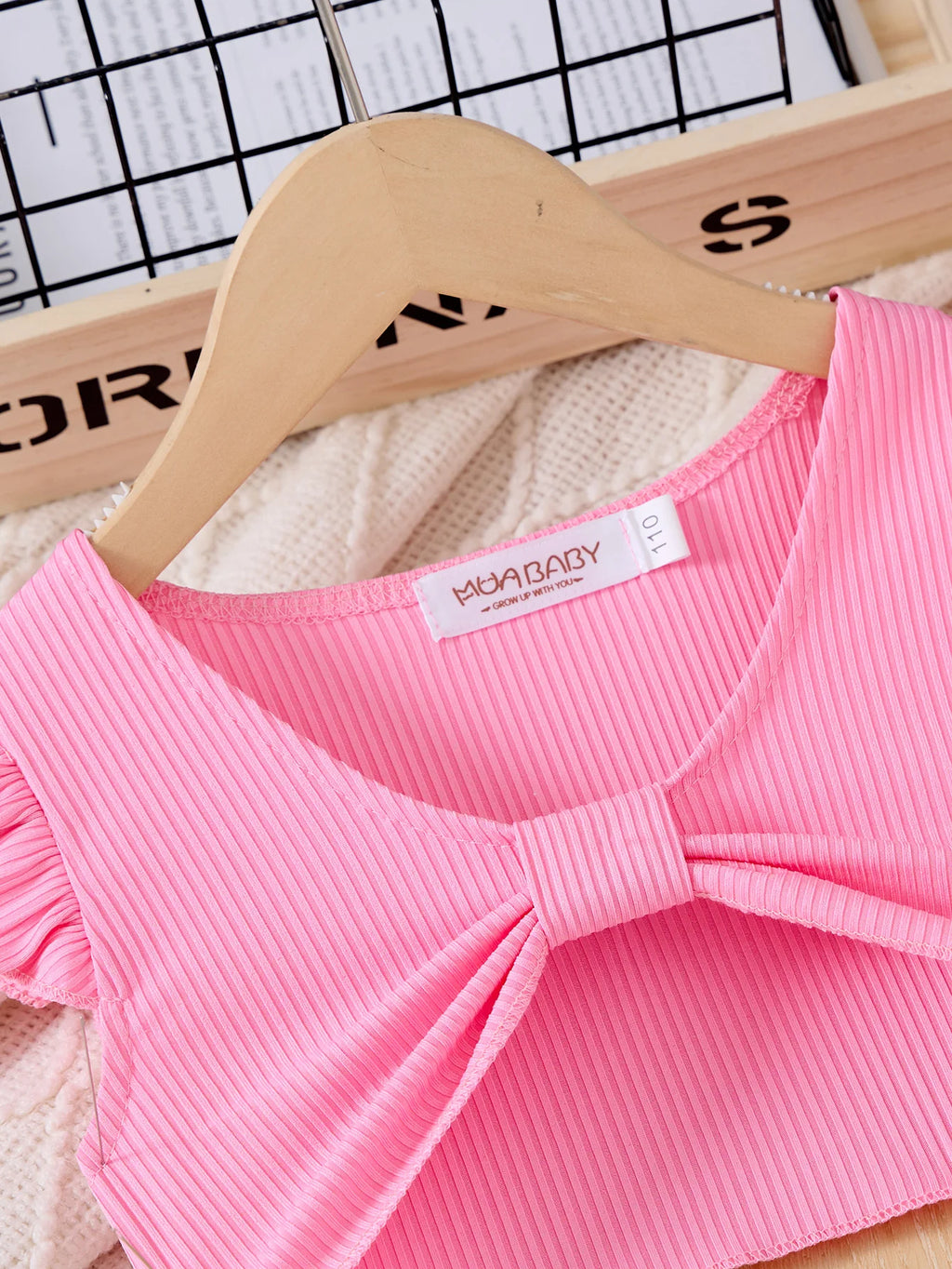 Children Casual Dress Girls Pink Knitted Top Floral Suspender Dress Summer Set close-up of pink ribbed top with bow detail