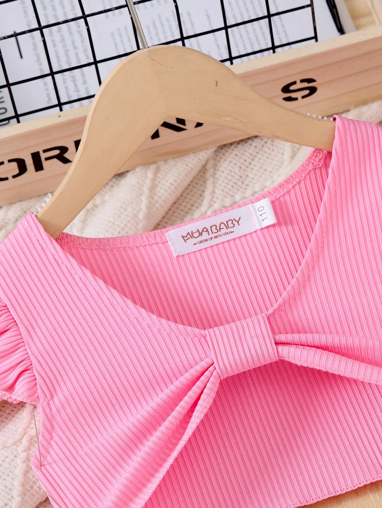 Children Casual Dress Girls Pink Knitted Top Floral Suspender Dress Summer Set close-up of pink ribbed top with bow detail