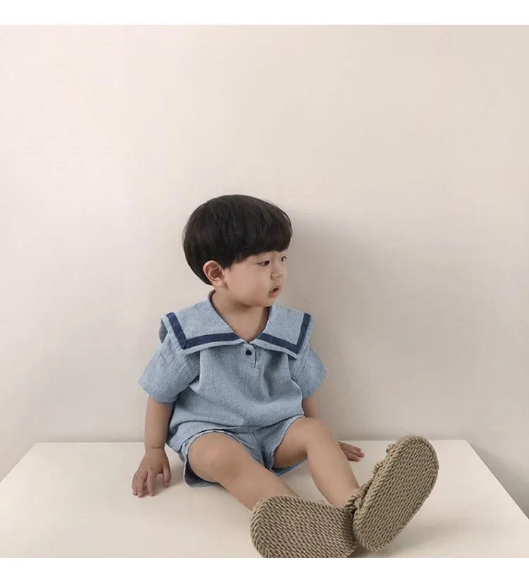 Children Clothing Sets Boys Girls Muslin Top Shorts 2pcs Cotton Baby Outfit worn by a toddler sitting on a white surface