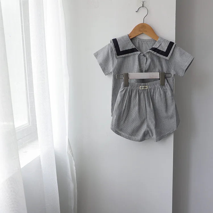 Children Clothing Sets Boys Girls Muslin Top Shorts 2pcs Cotton Baby Outfit in gray hanging on wall