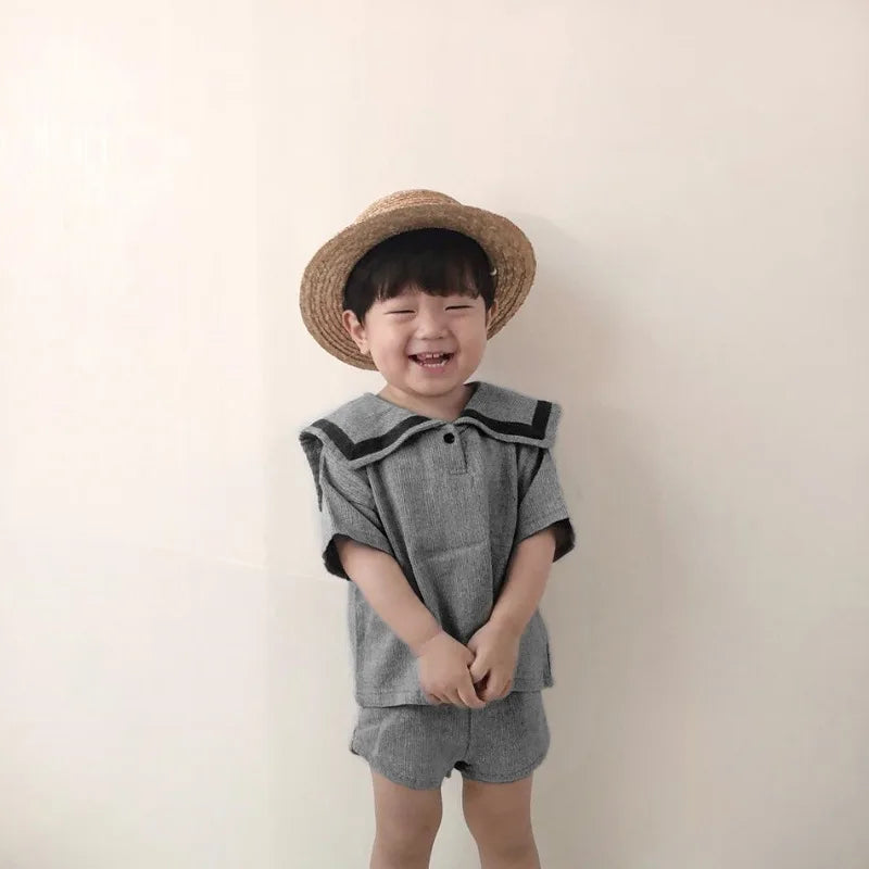 Children Clothing Sets Boys Girls Muslin Top Shorts 2pcs Cotton Baby Outfit worn by smiling toddler with straw hat