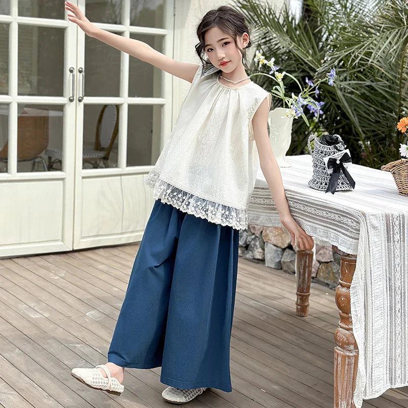 Children Clothing Sets Lace Sleeveless Top Wide-leg Denim Pants Girls Outfit worn by girl posing indoors