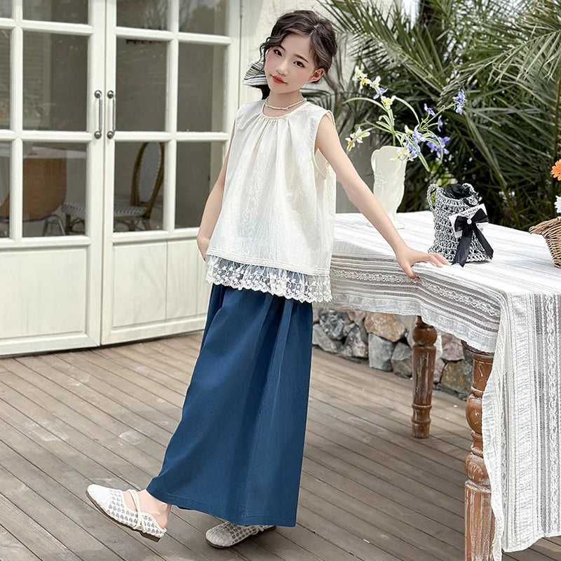 Children Clothing Sets Lace Sleeveless Top Wide-leg Denim Pants Girls Outfit worn by girl standing near table with flowers