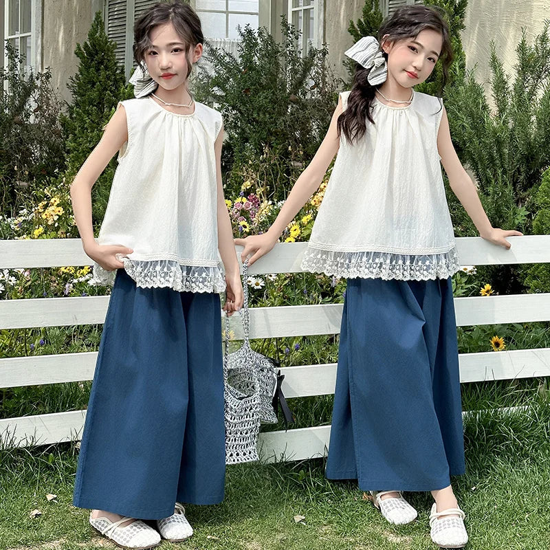 Children Clothing Sets Lace Sleeveless Top Wide-leg Denim Pants Girls Outfit shown on two girls outdoors with bows and white shoes