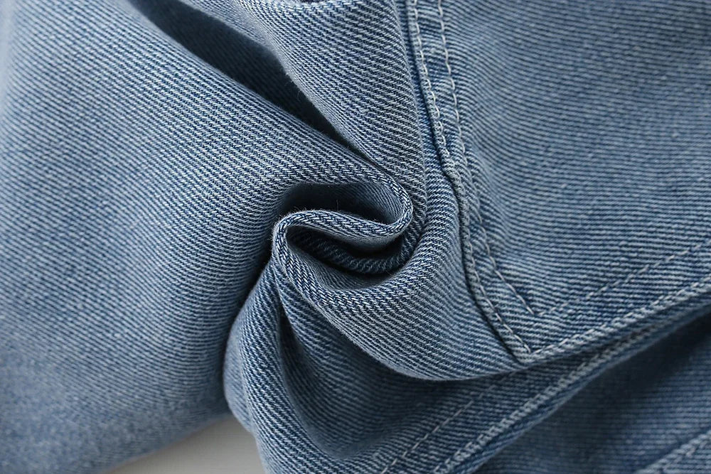 Close-up of blue denim jeans fabric with detailed stitching for children clothing sets long sleeve t shirt bow suspenders jeans girls baby outfit