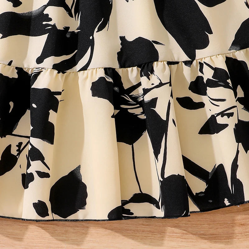 Children Fashion Dress Girls Black Long Sleeve Printed Elegant Party Dress close-up of black and white floral fabric