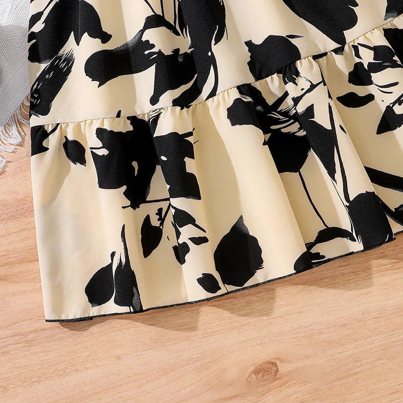 Children Fashion Dress Girls Black Long Sleeve Printed Elegant Party Dress close-up of black floral print on cream fabric