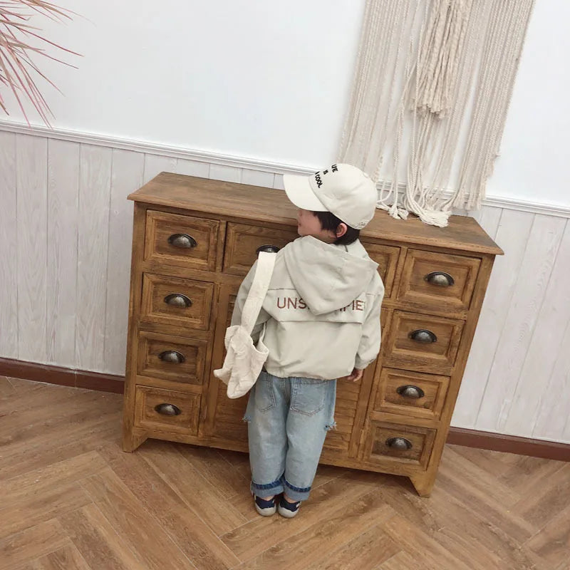 Child wearing Children Fashion Hoodies Korean Style Autumn Spring Long Sleeve Kids Hooded Coat standing by wooden cabinet