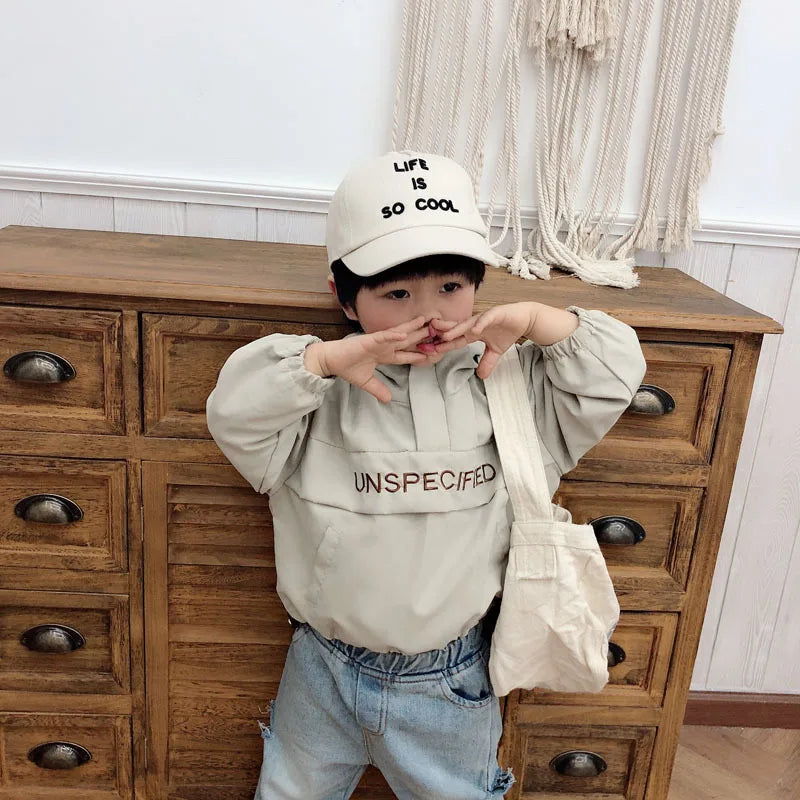 Children Fashion Hoodies Korean Style Autumn Spring Long Sleeve Kids Hooded Coat worn by a child with cap and tote bag