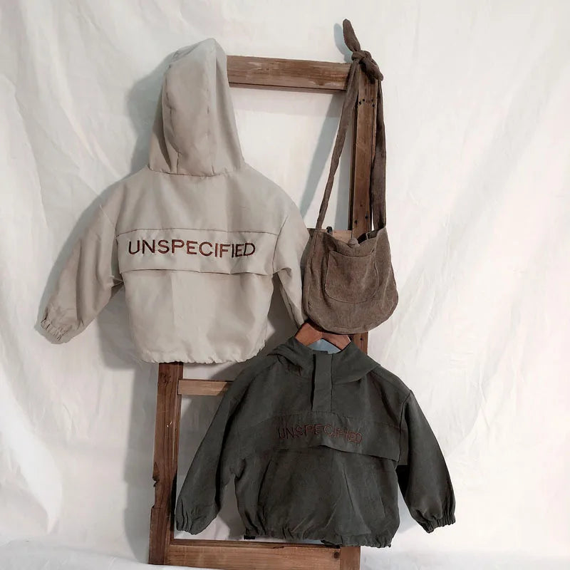 Children Fashion Hoodies Korean Style Autumn Spring Long Sleeve Kids Hooded Coat in beige and dark gray hanging on wooden rack