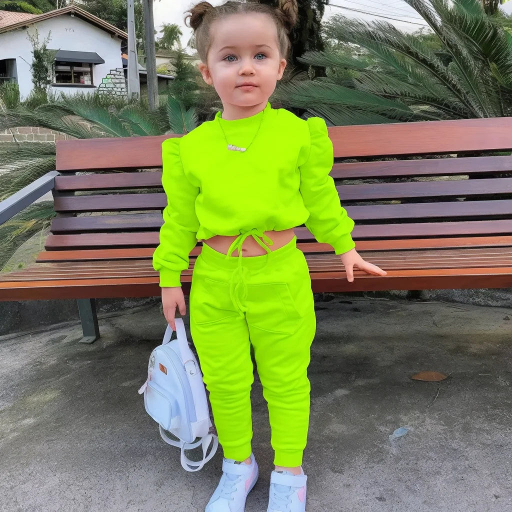 Children Girls Clothes Set Autumn Long Sleeve Crop Tops and Casual Pants Outfit in bright neon green worn by toddler outdoors