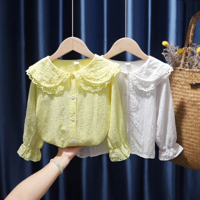 Children Girls Fashion T-shirts Lapel Blouse Breathable Top with Flared Sleeves in yellow and white colors hanging on wooden hangers