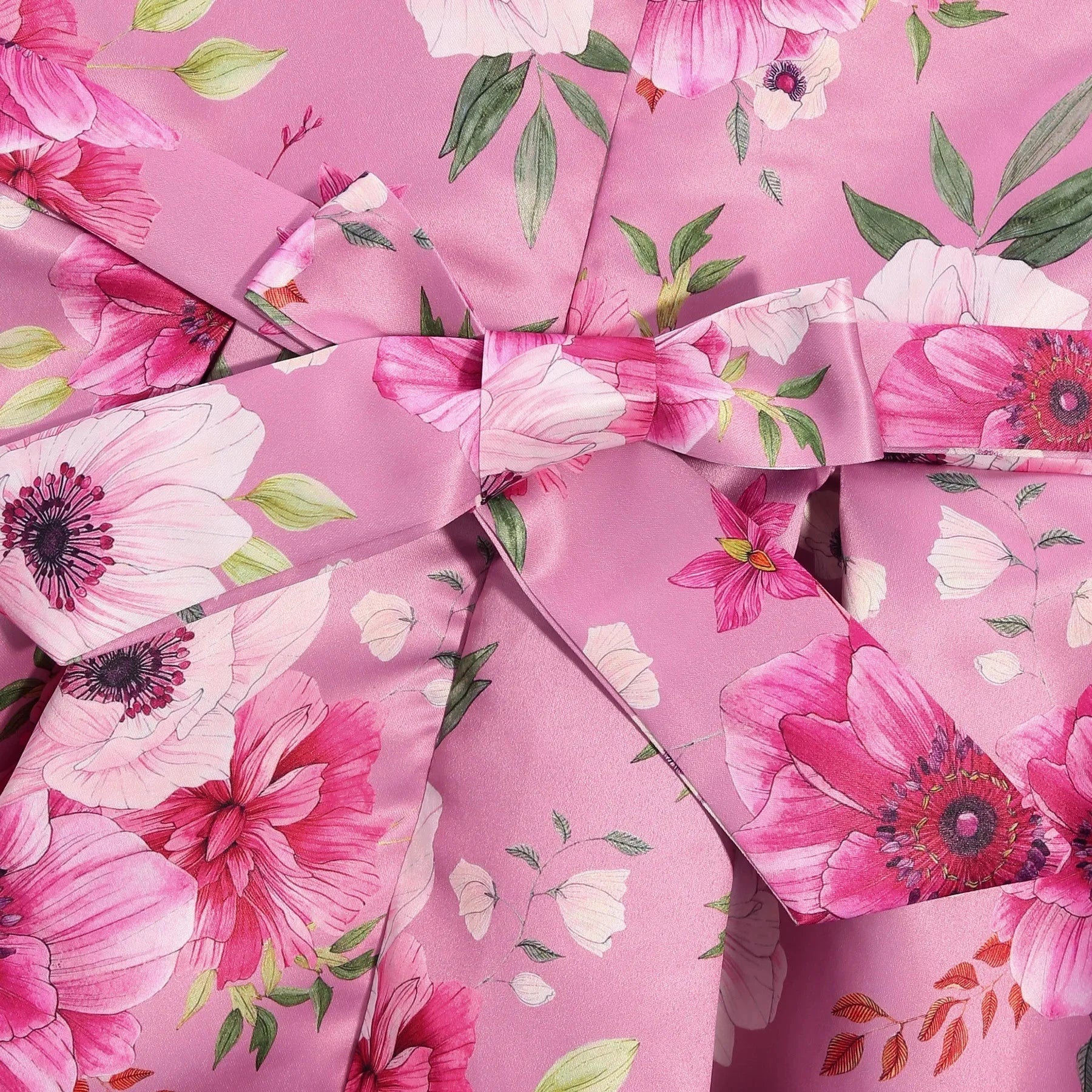 Children Summer Flower Print Dress with Flying Sleeves and Bowknot Detail in pink floral fabric close-up