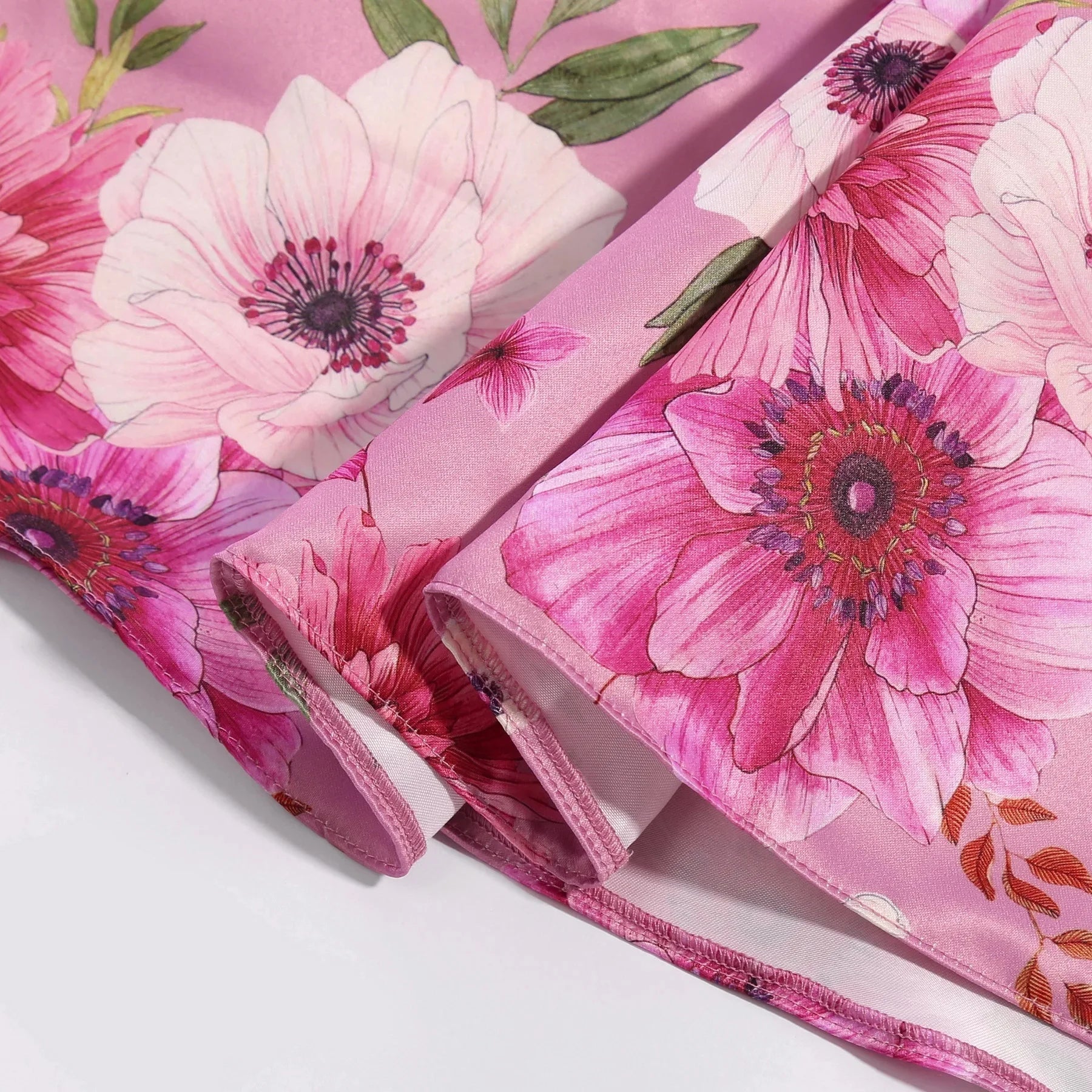 Close-up of Children Summer Flower Print Dress with Flying Sleeves and Bowknot Detail showing pink floral fabric and sleeve design