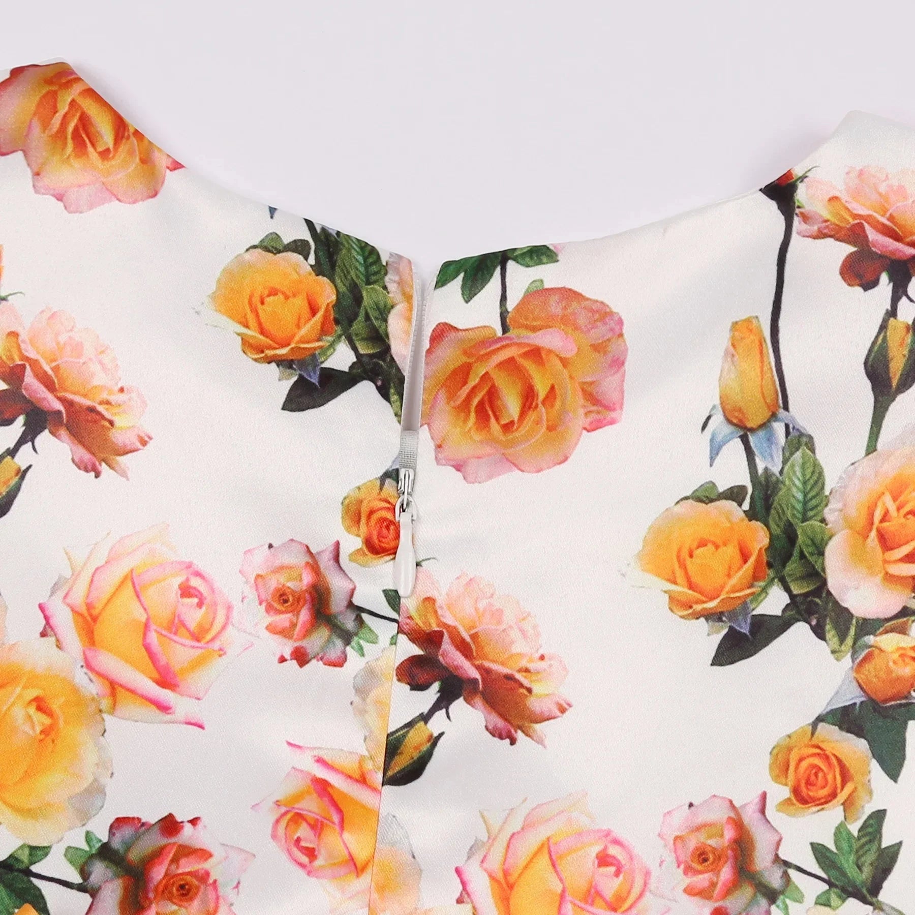 Close-up of Children Summer Flower Print Dress with Flying Sleeves and Bowknot Detail featuring yellow and pink roses on white fabric