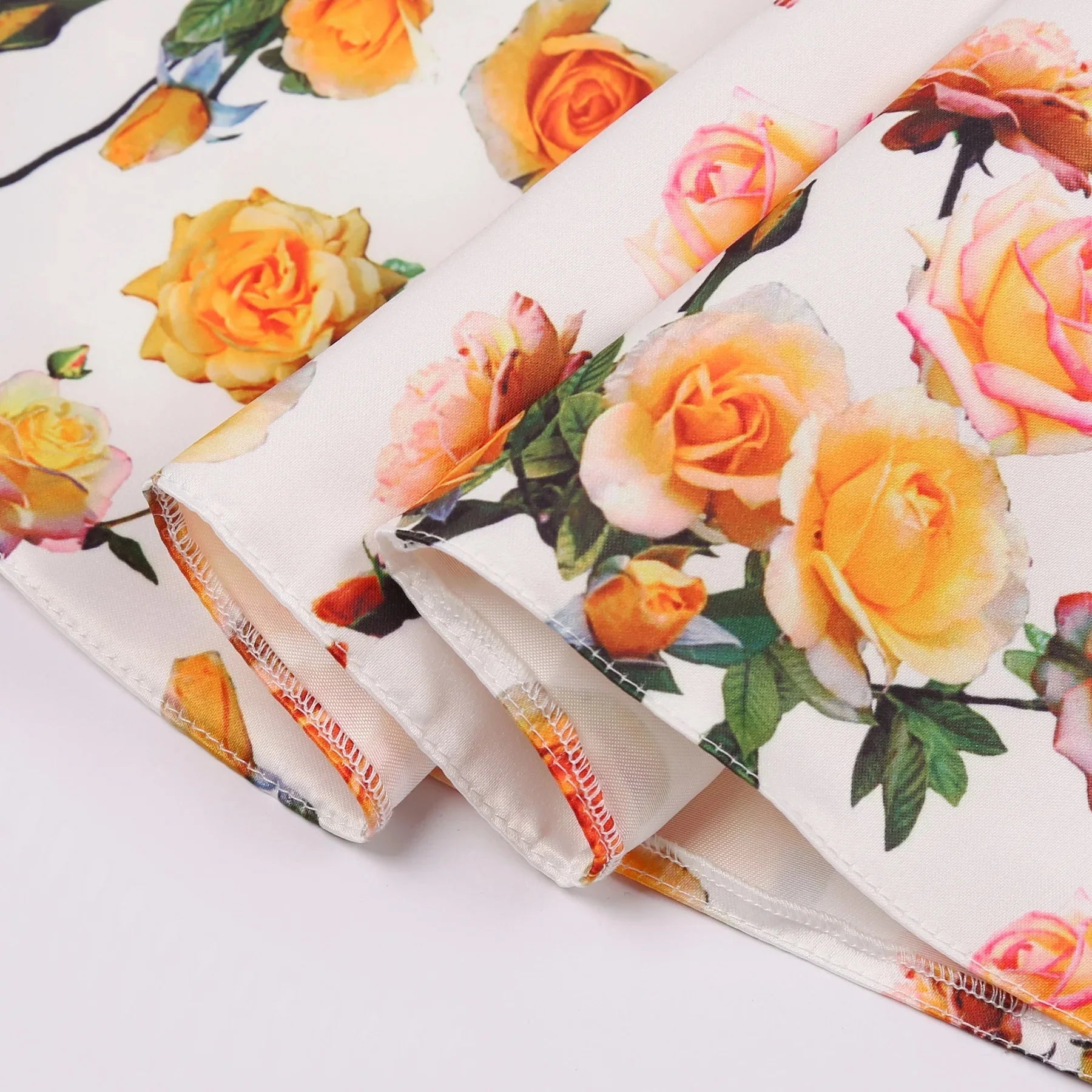 Close-up of fabric with floral pattern for Children Summer Flower Print Dress with Flying Sleeves and Bowknot Detail