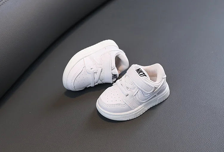 Children White Casual Sneakers Soft-Soled Running Shoes for Boys and Girls by Yamza Tots Closet on gray surface