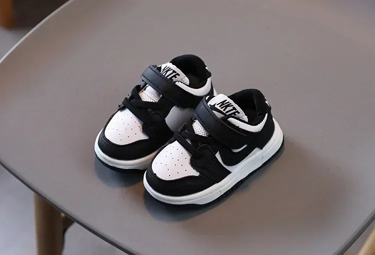 Yamza Tots' Closet black and white children's sneakers with Velcro straps and cushioned soles