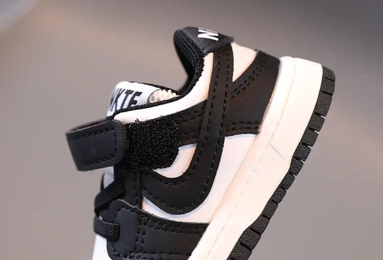 Black and white children's sneakers with Velcro strap by Yamza Tots' Closet