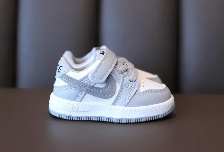 Yamza Tots' Closet white and gray children's sneakers with Velcro strap and cushioned sole