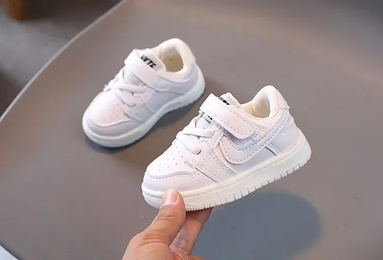 Yamza Tots' Closet white children's sneakers with velcro straps and cushioned soles