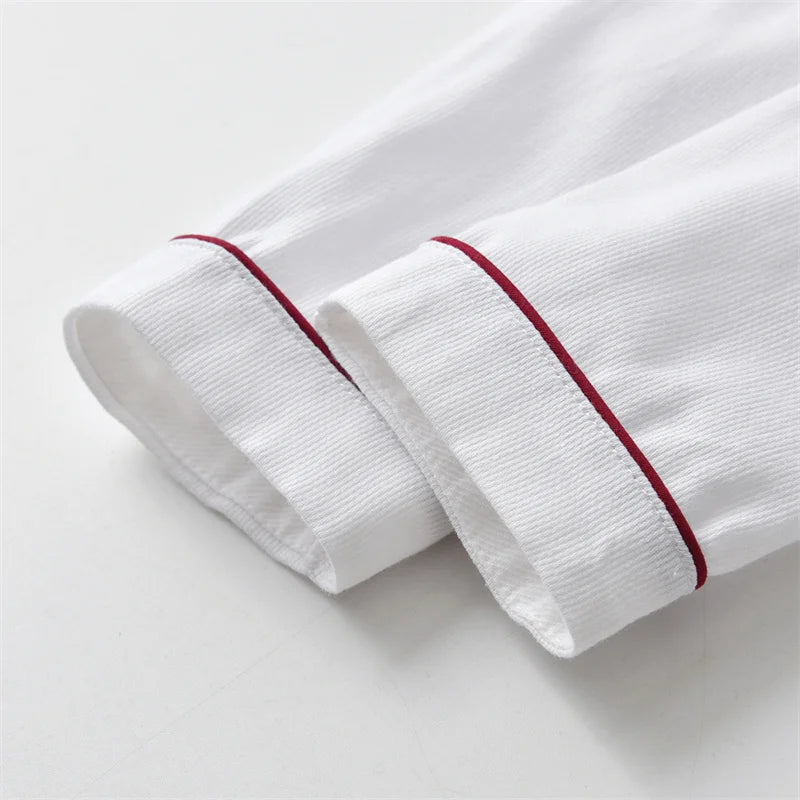 Close-up of white sleeves with red piping detail from Newborn Baby Boy Clothes Suit Birthday Wedding Velvet Pants Blouse 3Pcs Set