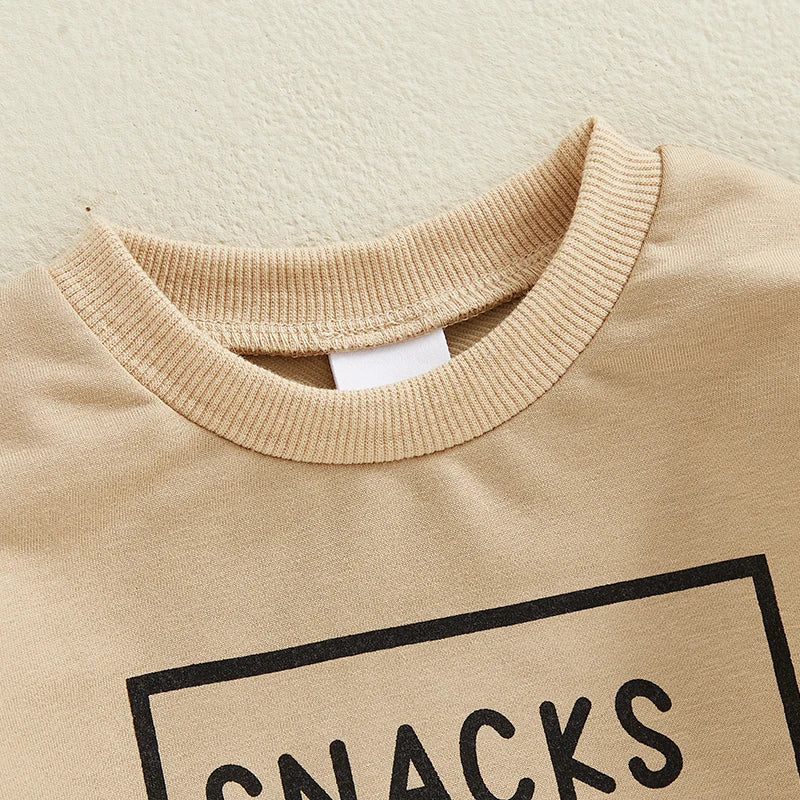 Close-up of beige boys outfit with Boys Outfits Letter Print neckline and snack graphic