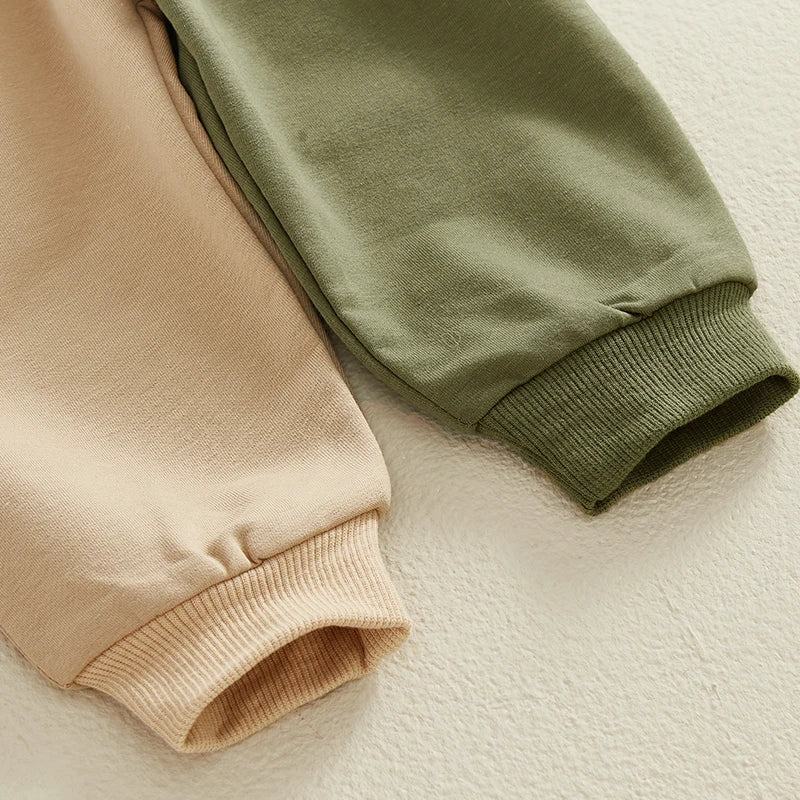Close-up of beige and green sleeves on boys outfits letter print sweatshirts by Yamza Tots Closet