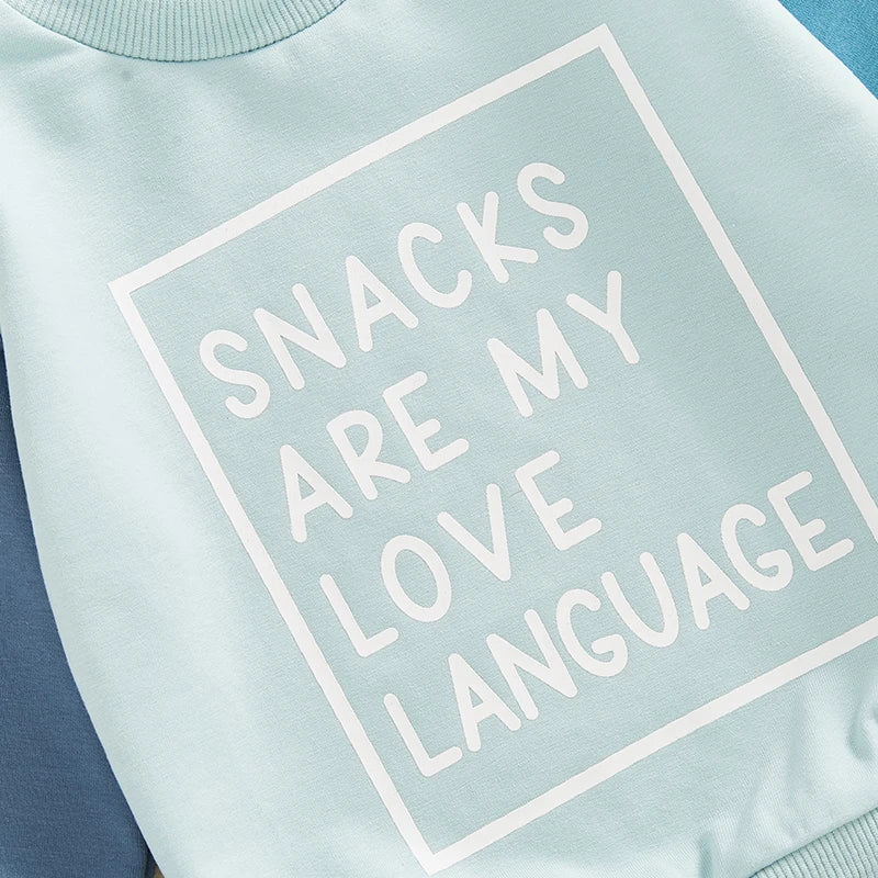 Close-up of a light blue boys outfit sweatshirt with Snacks Are My Love Language letter print