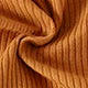 Close-up of soft ribbed fabric in warm brown color from Yamza Tots' Closet, comfortable fashionable material