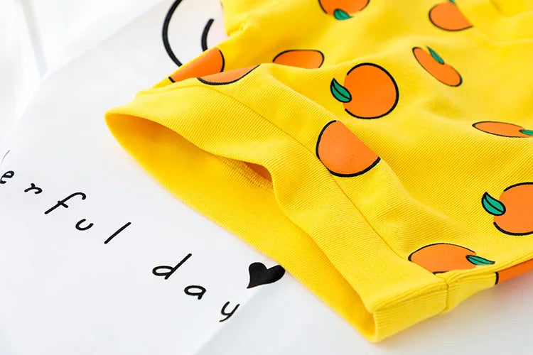 Close-up of yellow casual baby t-shirt with orange print from Cute Baby Clothes Set Casual T-shirt with Bib Denim Overalls for Kids
