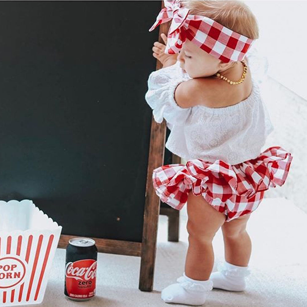Cute Baby Girl Summer Set Off-Shoulder Lace Tops Red Plaid Dress & Headband worn by toddler near popcorn and soda