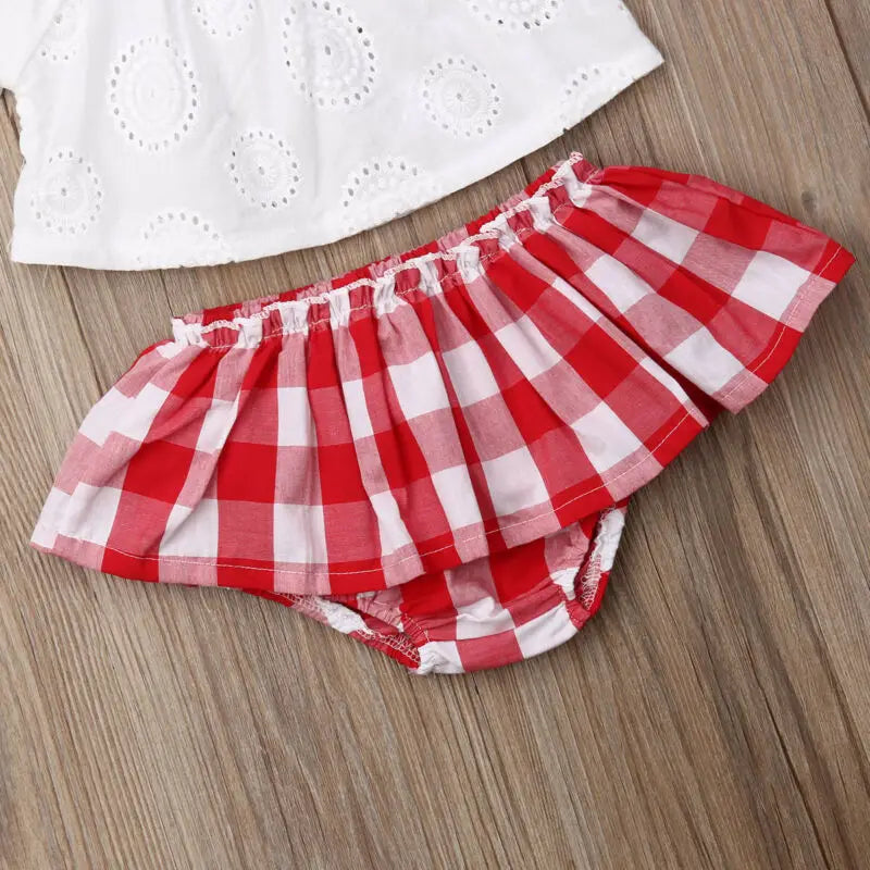 Cute Baby Girl Summer Set Off-Shoulder Lace Tops Red Plaid Dress and Headband laid flat on wooden surface