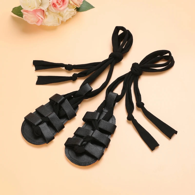 Cute Baby Girls Strap Sandals with Soft Rubber Sole Comfortable Summer Shoes in black with tie straps