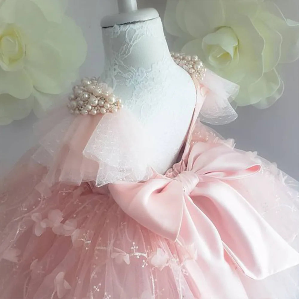 Elegant Girl Dress Pink from Yamza Tots' Closet with pearl details and large bow on tulle skirt