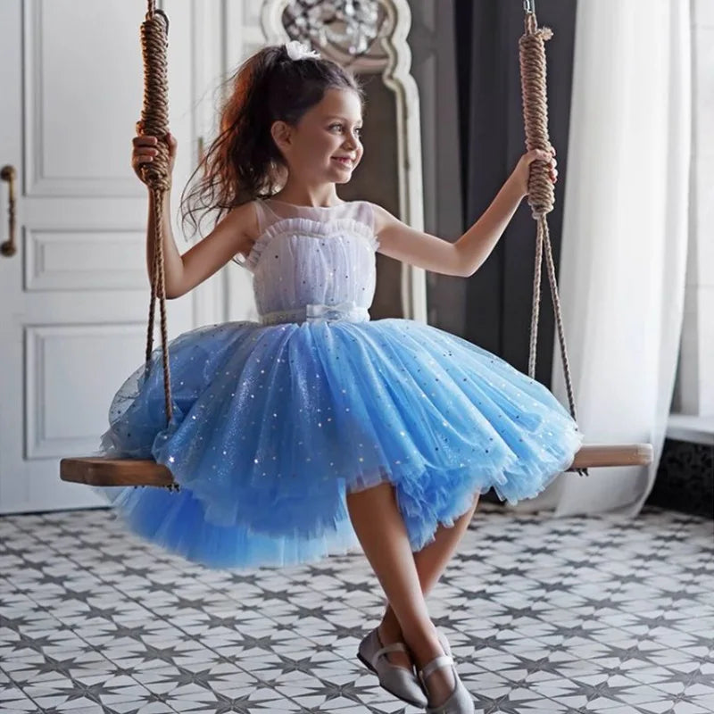 Fairy Girls Summer Sequin Stars Mesh Princess Dress Birthday Party Gift Kids worn by a girl sitting on a swing indoors