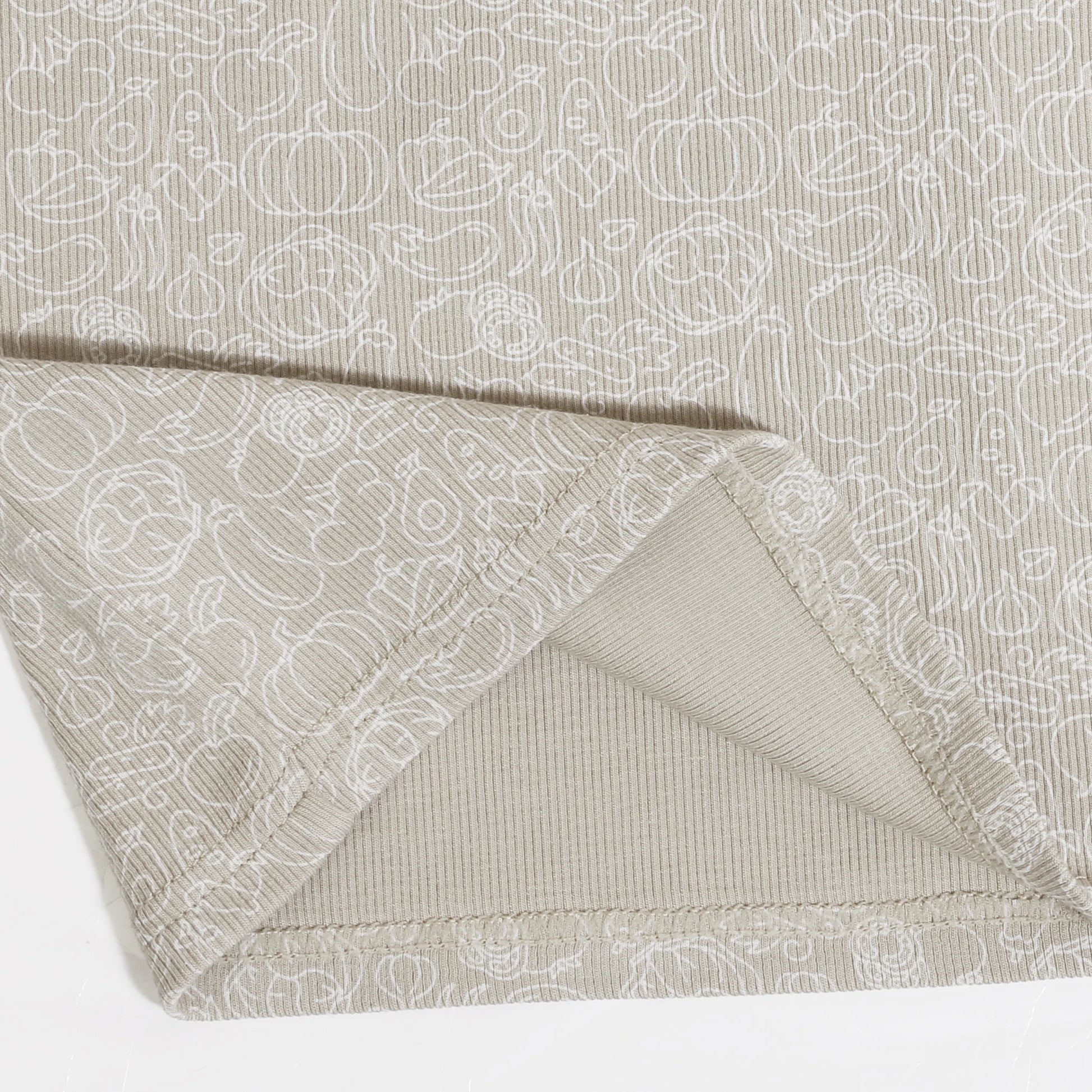 Yamza Tots' Closet beige fabric close-up showing Family Ribbed Print Sets for Summer and Spring pattern details