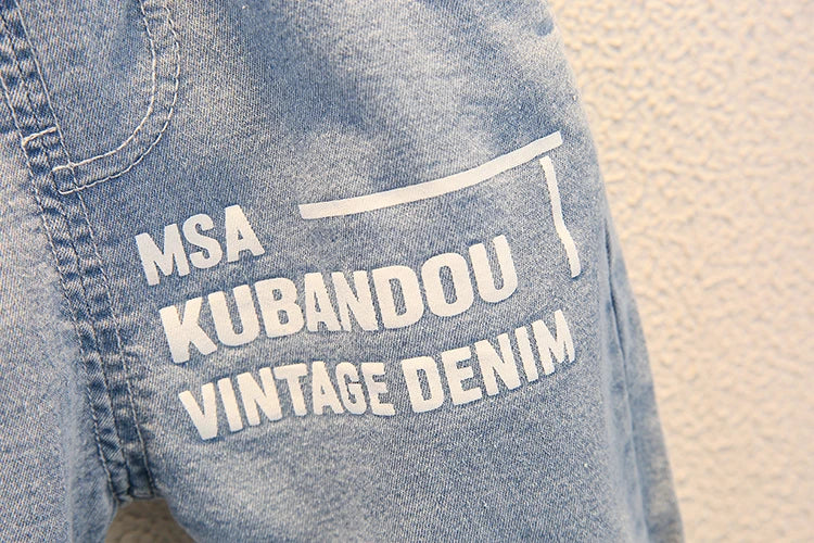 Close-up of vintage denim shorts with white lettering from Fashion Baby Boys T Shirt and Denim Shorts Summer Set Casual Kids Outfit by Yamza Tots' Closet