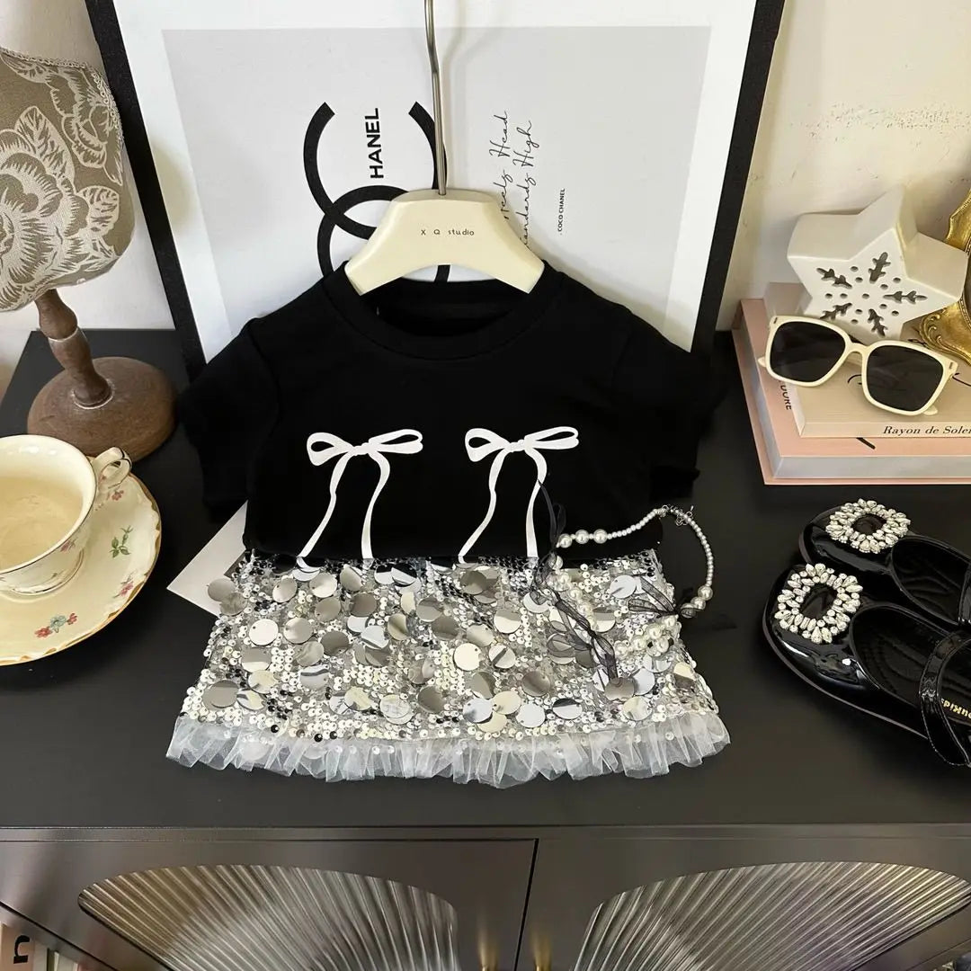 Fashion Baby Girl Bow T Shirt and Sequin Skirt Set Sparkle Kids Outfit in black with silver sequins and white bow details
